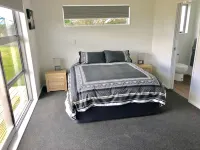 Brand New 3 Bedroom Beachfront Getaway.  Beach just across the road.
