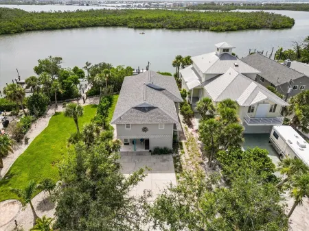 Private Bayfront Beach House w/ Dock & Spa, Steps to Beach and Restaurants