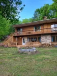 Spacious and cozy home with gas fireplace, boat dock, and lake views