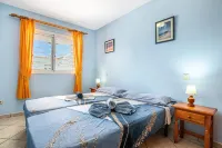Apartment Near the Beach with a Huge Terrace Patio, Wifi and Parking