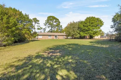 Spacious 4-Bedroom Retreat & Pet-Friendly Fenced Yard!