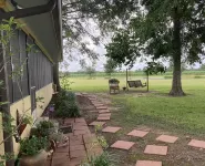 "My Playhouse" Enjoy the country views from the wrap around screened porch Hotels near Atchafalaya Basin Bridge
