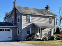 Rural cozy and quaint farmhouse with secluded patio and 15 minute drive to town.