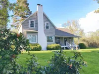 Cozy restored farmhouse on the river! Hot tub, wildlife, trails!