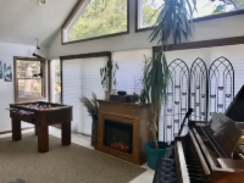 The Gray Escape Steps away from Lake Margrethe Hotels in Grayling Township
