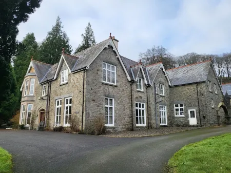 Victorian stone mansion in extensive grounds overlooking Bala Lake