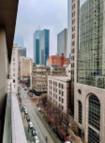 Modern 1-Bedroom City View High Rise Condo with Balcony Gym Pool Free Parking