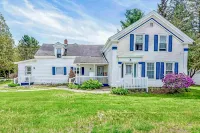 Spacious two-story duplex with a large yard, two full kitchens, & gas fireplace