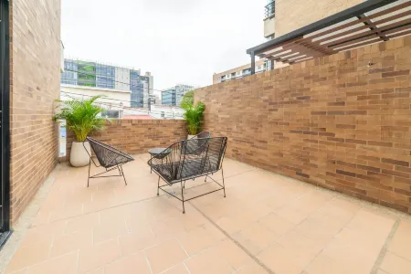 Capital by Wynwood House Отели рядом с достопримечательностью «Biblioteca Pública Virgilio Barco»