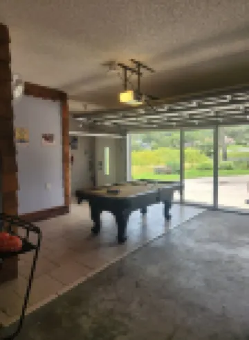 Charming lakefront 3BR 3BA house w/ EV chg in heart of Mt. Dora. Nature abounds.