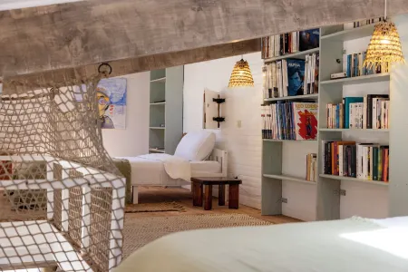 House between sea and scrubland near Arone beach in Piana, Corsica