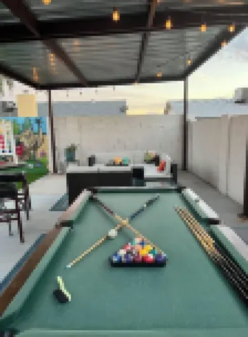 Resort Style Backyard- Heated Pool, Putting Green, Outdoor TV and Pool Table.