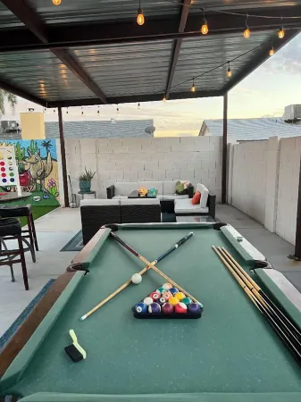 Resort Style Backyard- Heated Pool, Putting Green, Outdoor TV and Pool Table.