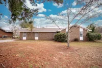 Spacious 4-Bedroom Retreat & Pet-Friendly Fenced Yard!