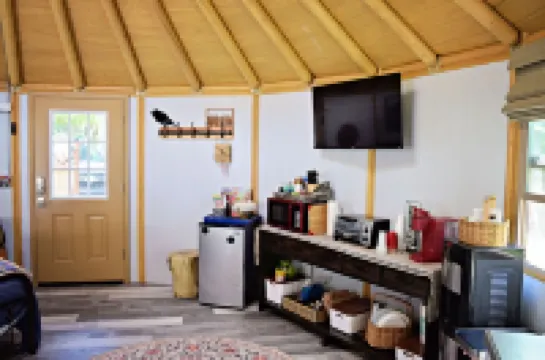 Fanciful mountainside yurt with private bathhouse