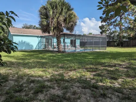 • Pool home • Spacious yard •
