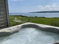Oceanfront cabin with private beach and hot tub