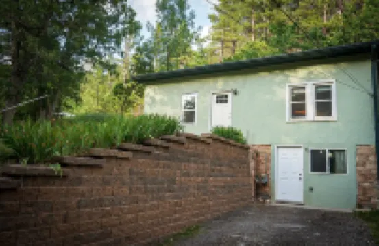 Remodeled home in the woods, just past city limits. With horse pasture nearby!