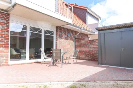 Modern first floor apartment with sauna and beach chair in the garden for 4 persons Отели в г. Норден