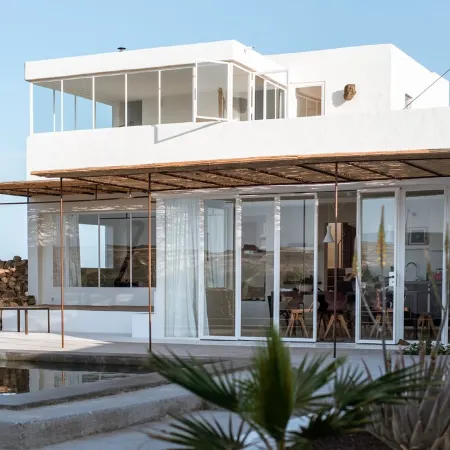 An architectural oasis with large swimming pool, along a breath-taking scenery.