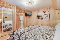 Only Minutes to Attractions with Indoor Sauna, Hot Tub, Games, and Fireplace!