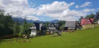 Domek Gabi z balią w Ogrodzie Hotels in Poronin