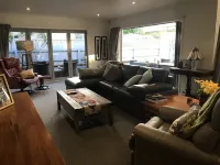 A modern house close to town and the beach and backs on to a tree lined park