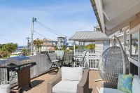 Beach Retreat w/ Sundeck, Golf Cart & Bikes Bungalow House by Avantstay