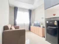 Soft Grey 1BR at Royal Sentul Park Apartment By Travelio