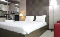 Prime and Comfy Studio at Tamansari la Grande Apartment by Travelio