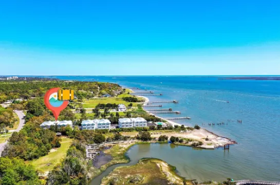 No Cleaning Fee! Brand New Double Queen Studio Condo w/ Waterfront Pool + Beach