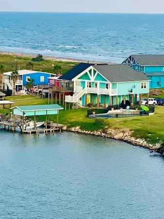 Beautiful beach house boasts a scenic water view from its front and back doors.