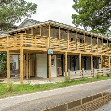 Classic Pawleys. Just Renovated. Long, breezy porches. Steps to beach and creek.