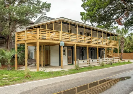 Classic Pawleys. Just Renovated. Long, breezy porches. Steps to beach and creek.