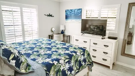 5-8 MINUTE WALK TO BEACHES, DINING & SHOPPING! RARE PRIVATE PATIO & LAKE VIEW!