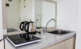 Minimalist Studio Apartment at Poris 88 with City View