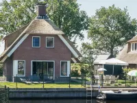 Villa in Friesland with Waterfront Garden Hotel dekat Watervilla park Idskenhuizen