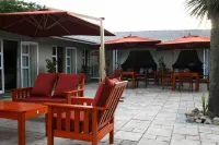 Flying Falcon Guesthouse Hotels near Tsutsumani