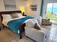 Sand Pebble 1 Bdrm Apt on Marley Beach w/ ocean views & steps to private beach