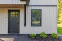 Charming 2-bedroom apartment nestled in a quiet neighborhood with nearby stream.