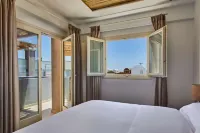 Sea Breeze Santorini Beach Resort, Curio Collection by Hilton - Beach