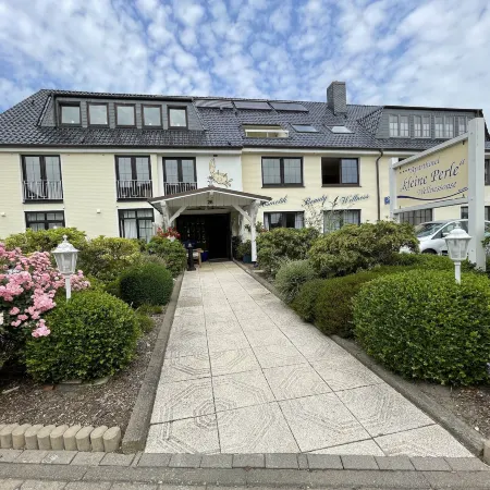 Aparthotel Kleine Perle Отели в г. Куксхафен