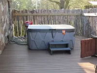 Restored rock house with hot tub and beautiful private deck.