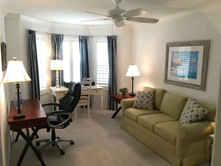 Bright Coastal Decor and Golf Cart - Inviting Luxury Retreat