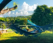 Tiny house on an acre with ocean view and private infinity pool.
