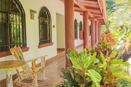 Private suite 102 with beautiful gardens, shared pool and BBQ area!