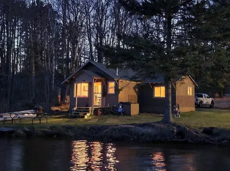 Cozy cabin right on the water! All bikers, skiers, fisherman and more welcome!