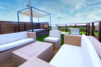Roof Balcony with BBQ and Jacuzzi Projector Equi Hotels in Nakijin
