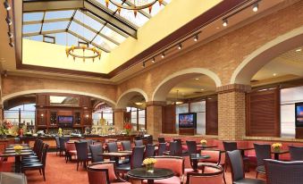 a large dining room with multiple tables and chairs arranged for a group of people to enjoy a meal together at Ameristar Casino Hotel Council Bluffs