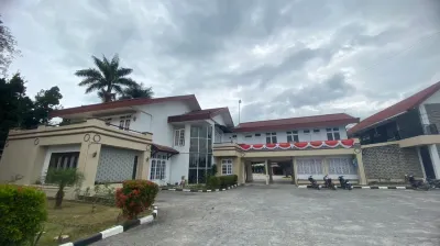Hotel Ompu Herti Hotel dekat Air Terjun Sigura-Gura